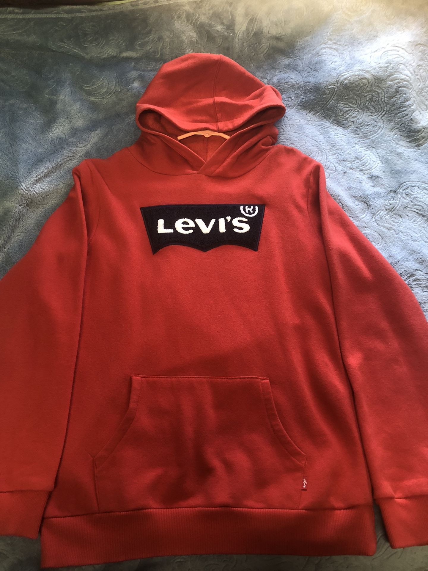 Levis red hoodie with embroidered bat print logo in the center