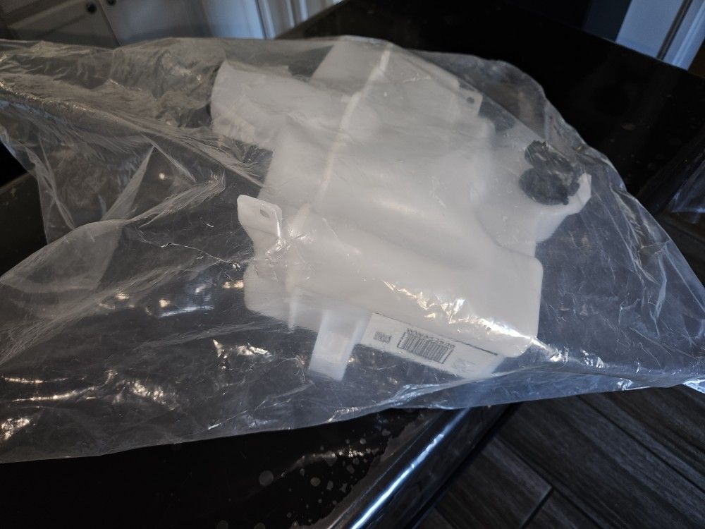 TRQ windshield washer reservoir, likely for a 2014-2019 Toyota Corolla.