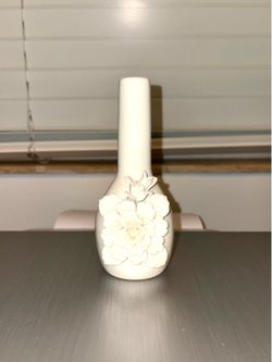 White porcelain vase with flowers from the Tozai Home brand, handmade in China. The design features intricate floral details.