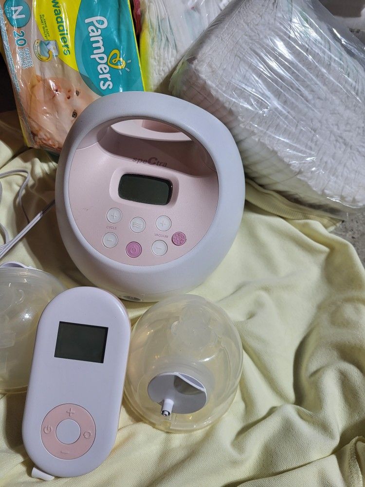 2 Breast Pumps With A Hands Free And A Spectra Breast Pump + Hands Free Wearable Breast Pump + 3 Unopened Packs Of Pampers Newborn Diapers