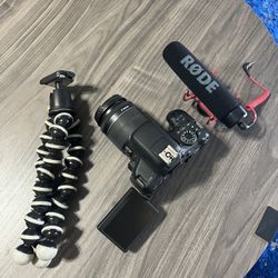 Canon T6i with Rode pro mic and joby tripod
