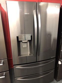 New scratch and dent LG black and stainless steel French door fridge with bottom freezer. 1 year warranty