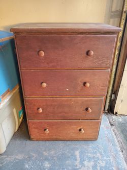 Four-drawer wooden dresser.
