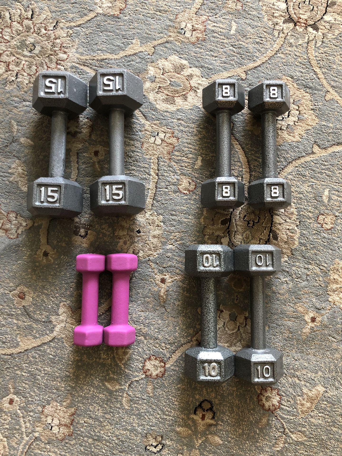 Workout weights, 15 lb weights, 10 lb weights, 8 lb weights, and 3 lb weights Dumbbells