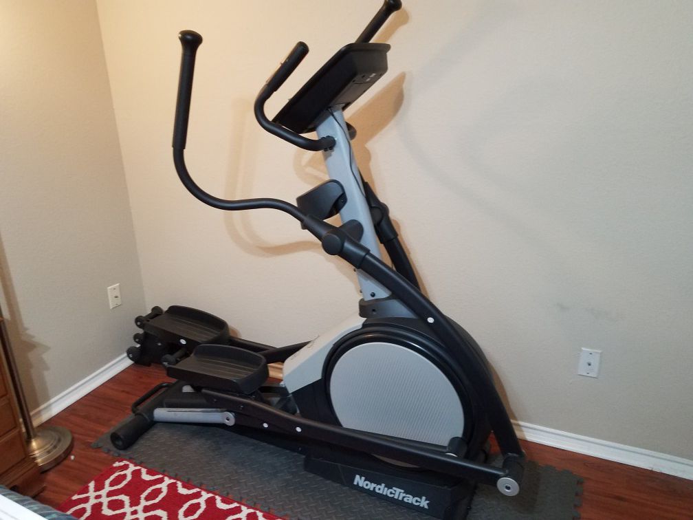 NordicTrack E7 SV Front Drive Elliptical and set of dumbell weights