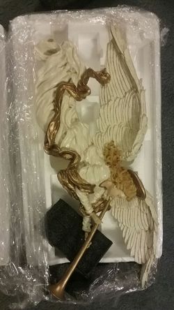 Ceramic Angel with Ford big horn and hands head broke but they have been glued back together as you can tell it is a hang on the wall type Angel