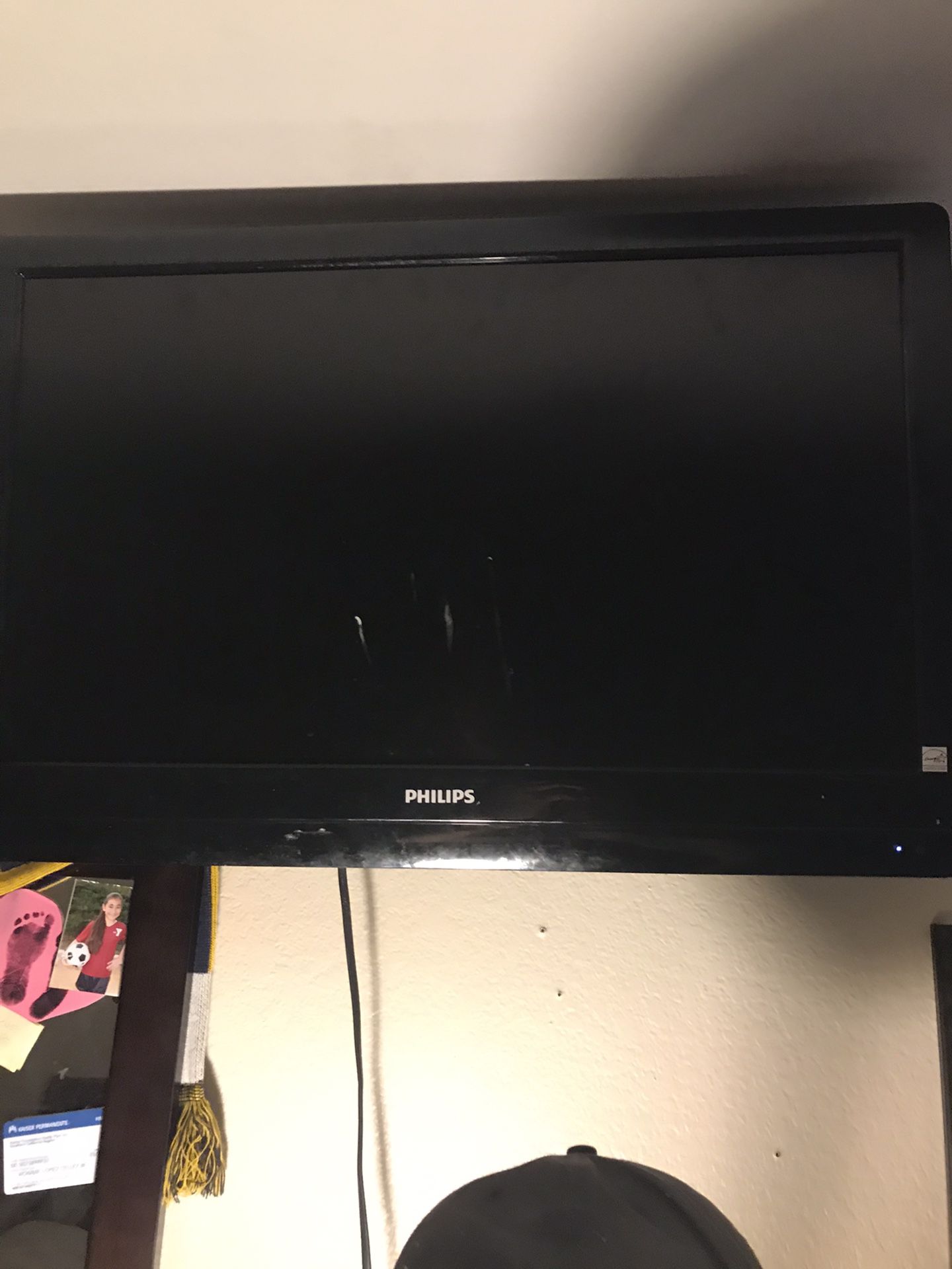 32” Phillips TV with wall mount and remote