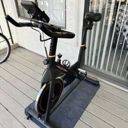 UREVO indoor Cycling Bike, Stationary Exercise Bike 350 lbs Weight Capacity, Ipad Mount, Comfortable Seat Cushion, Silent Belt Drive Cycle Bike for Ho