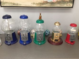 Coin operated candy machine dispensers.