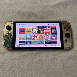 NINTENDO SWITCH OLED + 125 SWITCH GAMES and 7500 RETRO GAMES