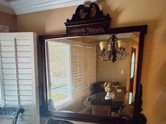 Large mirror in carved wooden frame