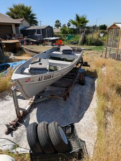 John boat with trolling motor and trailer