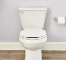 American Standard Reliant Two-Piece 1.28 GPF Single Flush Round Standard Height Toilet with Slow-Close Seat in White