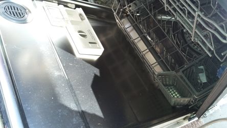White KitchenAid dishwasher with stainless steel inside