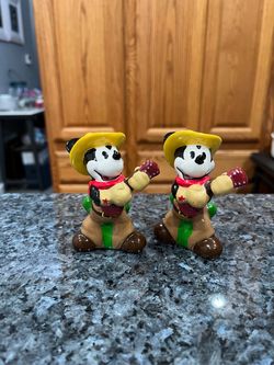 Disney Western Cowboy Mickey Mouse with a Guitar Pair of Salt and Pepper Shakers. Size approximately 3 1/2 inches tall. Preowned. Has been on displ