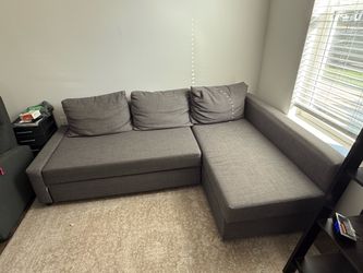 Gray couch with pullout bed