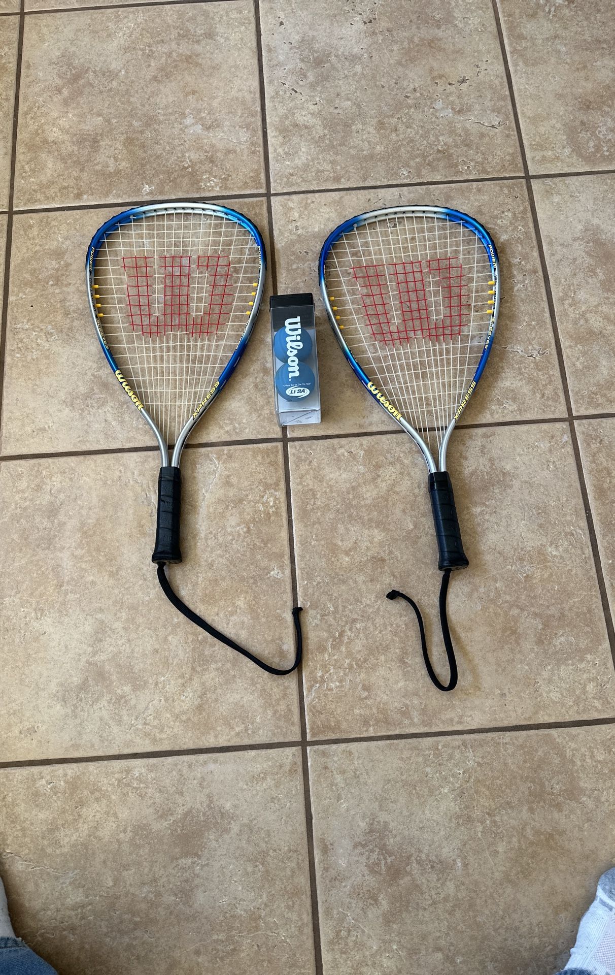 Two Racquet ball rackets and 2 balls