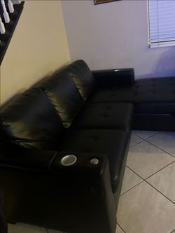 Black leather couch/queen bed