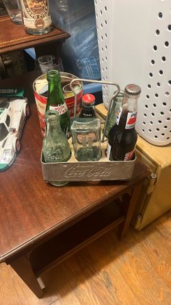 Vintage bottles and Coca-Cola carrier