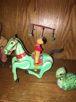 Antique metal toys and drummers I’m not sure of value but they all work .