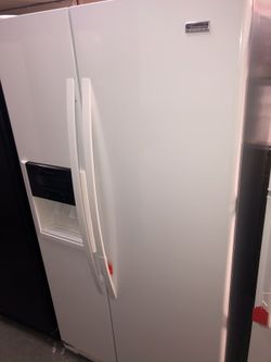 Used kenmore Elite side by side fridge. 1 year warranty