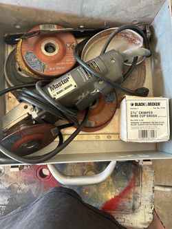 Black and Decker 4.5 inch grinder set with box, wheels , attachments .