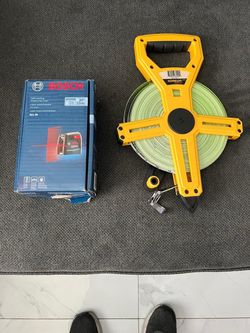 Komelon fiber reel new 200 ft and bosch cross line laser new asking $90 for  both thanks