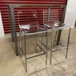 Stilt 42" High Dining Table and Set of Clear Stools