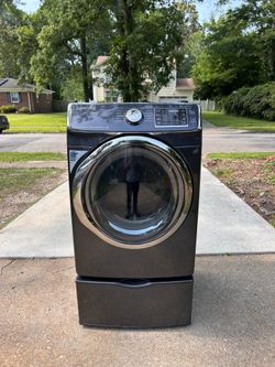 Samsung stainless steel dryer on pedestals