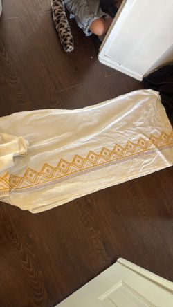 2 white yellow curtains