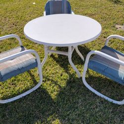 PVC outdoor patio set, 42 " table with 3 chairs.
Material: The frames are constructed from high-quality, waterproof PVC.
Cushions: The chairs feature