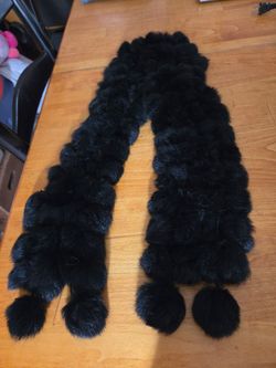 Black faux fur scarf.  All like little black pom poms.