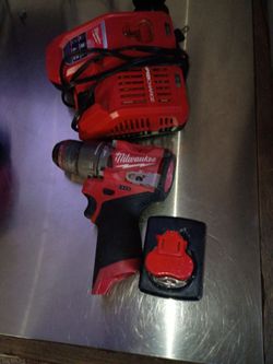 Milwaukee charger and battery Slightly used For sale