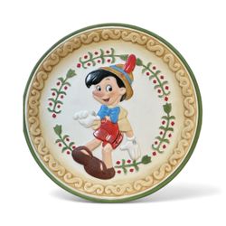 Walt Disney Pinocchio collector's plate.  The plate features a 3D, or "relief," design of the character Pinocchio from the 1940 Disney animated classi