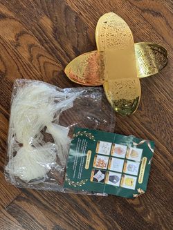 59 metallic gold laser-cut party favor boxes with ribbons