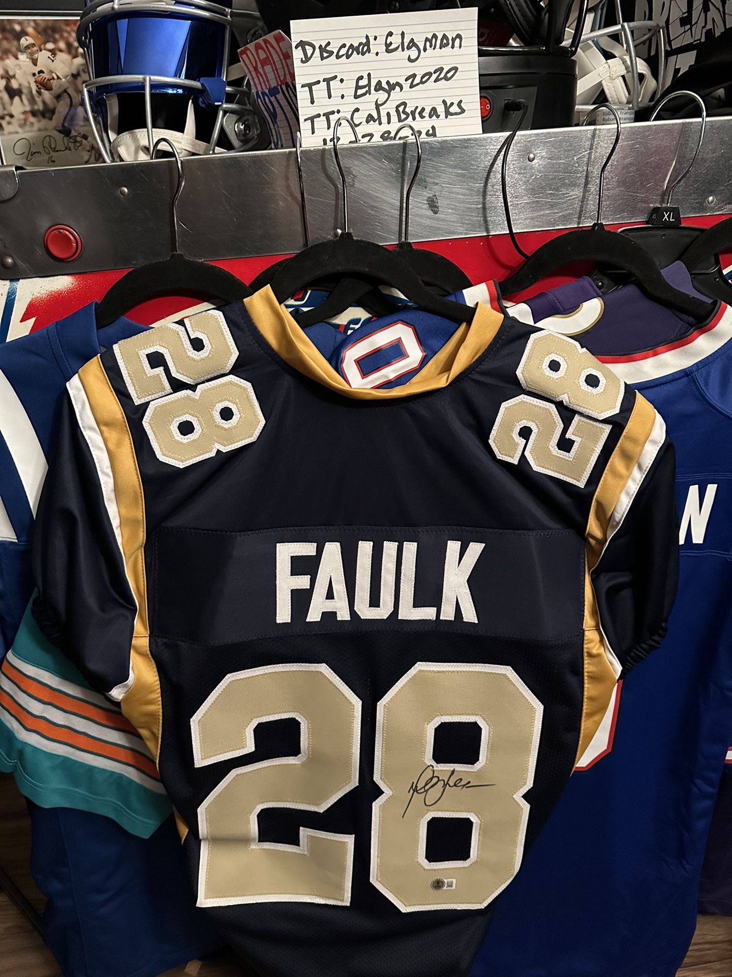Marshal Faulk Signed Rams Jersey.