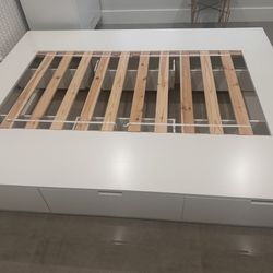 IKEA queen platform bed with storage drawers, white.