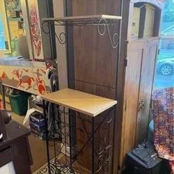 Standing metal and wood Shelves wine rack and holds wine glasses. A couple small blemishes that a little touch up black paint can fix. I put the pictu