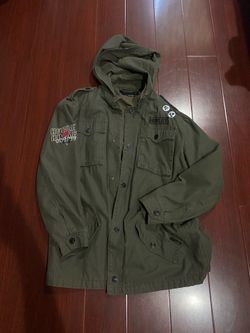 Green Hurley jacket with pins and patches