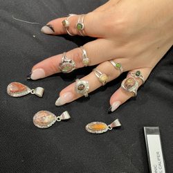 Lot of Mexican opal rings and charms finished in 925 sterling silver