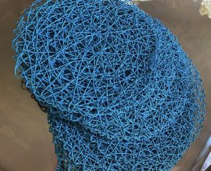 12 Pcs blue, round, woven placemats. $17