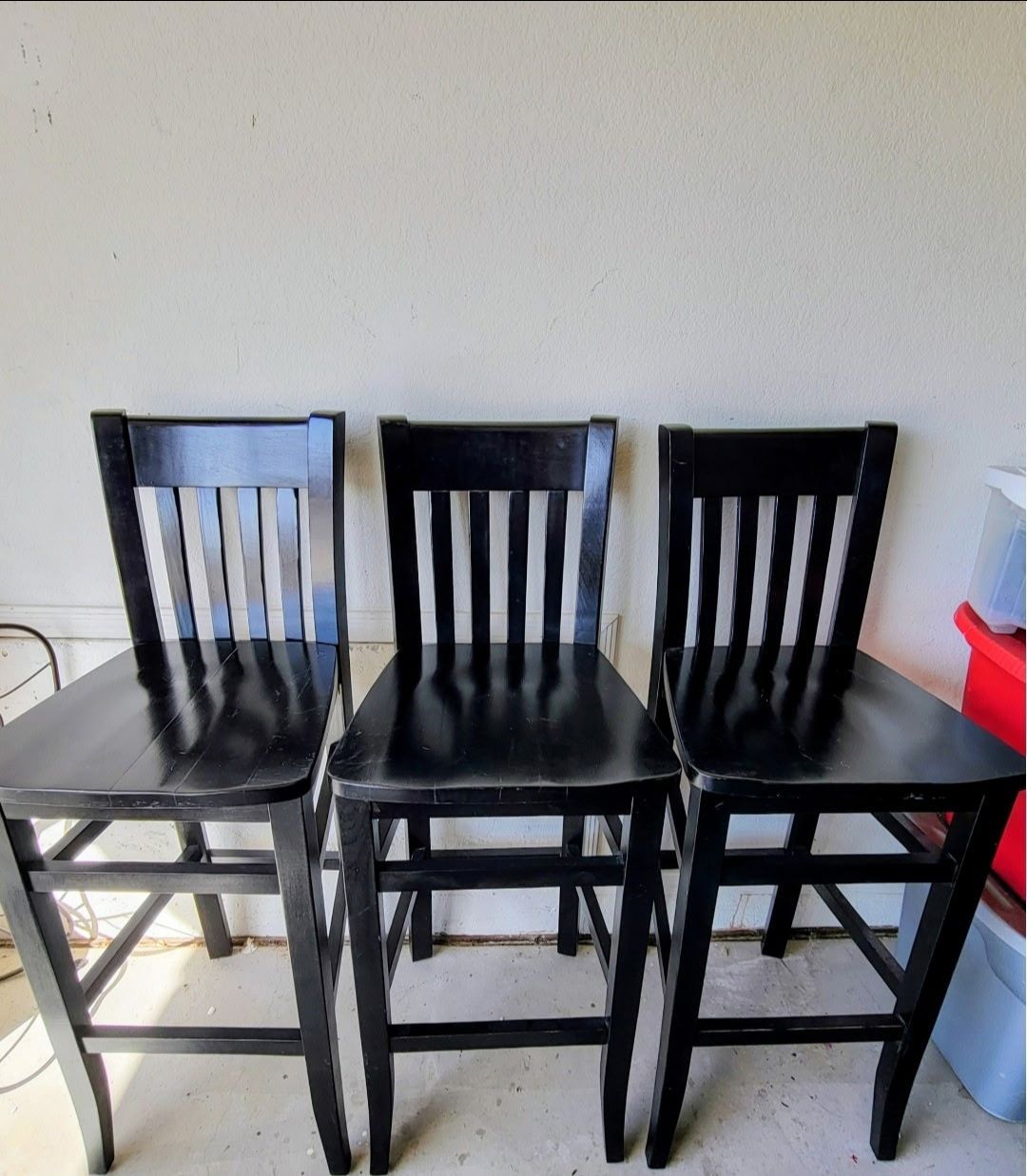 Three wooden bar stools