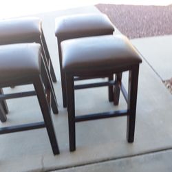 Bar stools. Solid wood legs leather tops