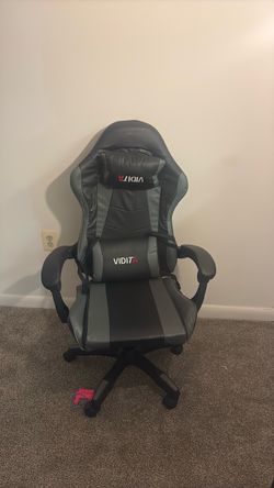 Lower back and neck supported gaming chair