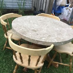 A Nice Round  Table With  Four Old Fashioned , Vintage  Chairs 