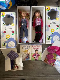 Dolls by American girl dolls each with an outfit
