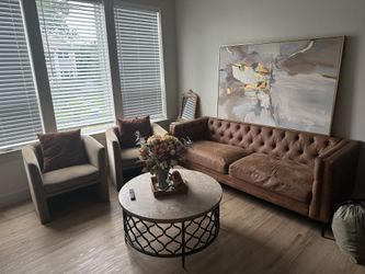 Brown sofa, two accent chairs and coffee Table