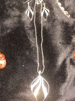 Assortment of necklaces and charms.