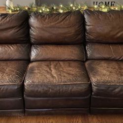 Brown Leather reclining Sofa with Brown leather recliners and a Coffee Table