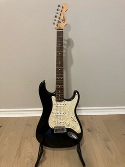 Electric Guitar Package - Squire Strat and Blackstar Amp, leather strap, 4 educational books.  $100